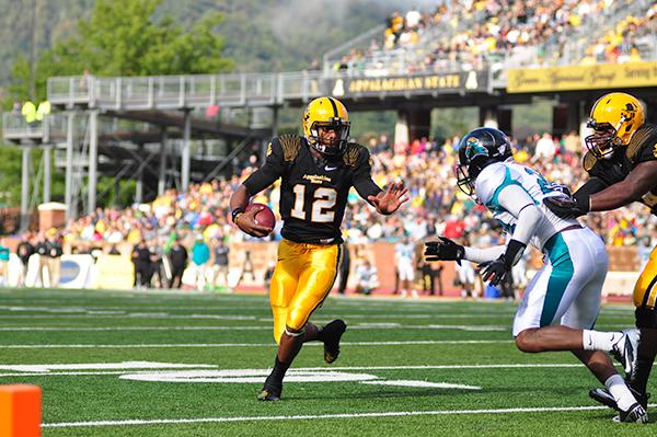 Senior quarterback Jamal Londry-Jackson runs the ball toward the endzone against Coastal Carolina last season.  Londry-Jackson is 40-62 for 414 yards this season. He has thrown two touchdowns and averages 138 passing yards per game. Photo by Justin Perry  |  The Appalachian