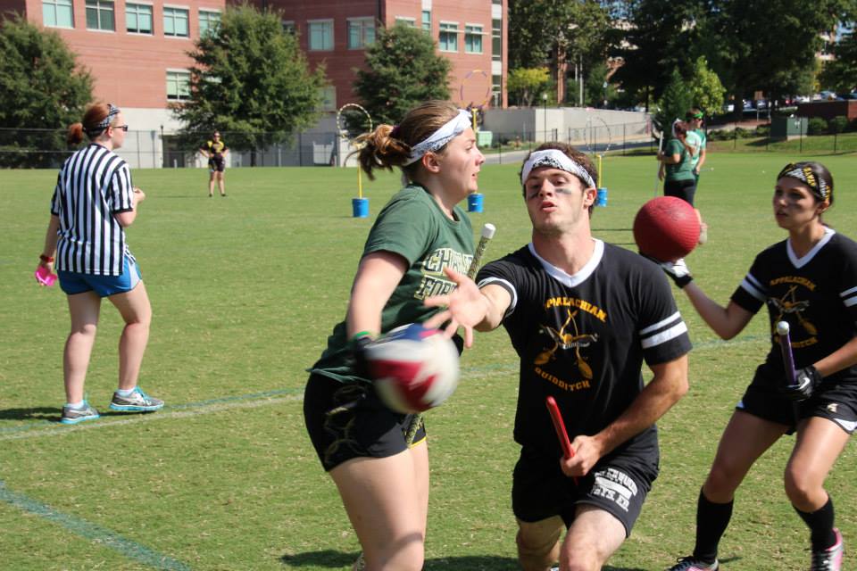 Chaser Sean Ecker tosses the quaffle before taking a hit from a UNC Charlotte chaser.   Jacob Huddleston  |  Courtesy Photo