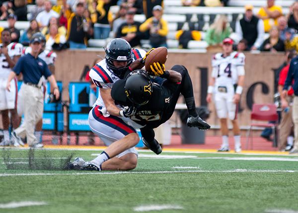 Senior wide receiver Tony Washington is clotheslined by the Samford defense during Saturday's homecoming game. The Mountaineers were dominated by the Bulldogs 34-10.  Photo by Rachel Krauza  |  The Appalchian