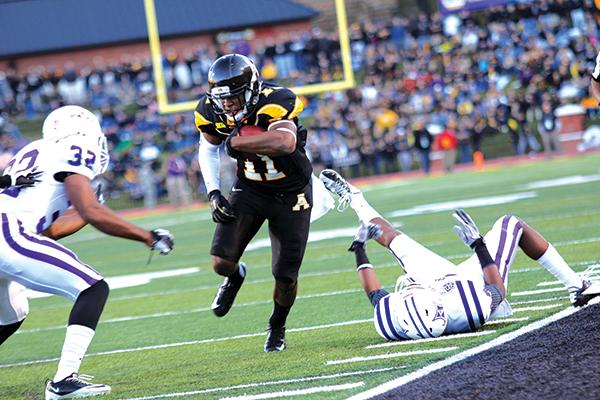 Senior wide receiver Andrew Peacock dodges away from the Furman defense during last seasons matchup. The Mountaineers will face the Paladins on the road Saturday. Photo by Paul Heckert  |  The Appalachian