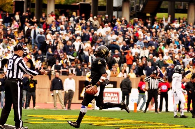 Sophomore quarterback Kameron Bryant runs the ball into the end zone from the two yard line in their annual Black Saturday game against Georgia Southern. He finished 27-33 for 381 yards and two touchdowns. The Mountaineers beat the Eagles 38-14. Photo by Justin Perry  |  The Appalachian