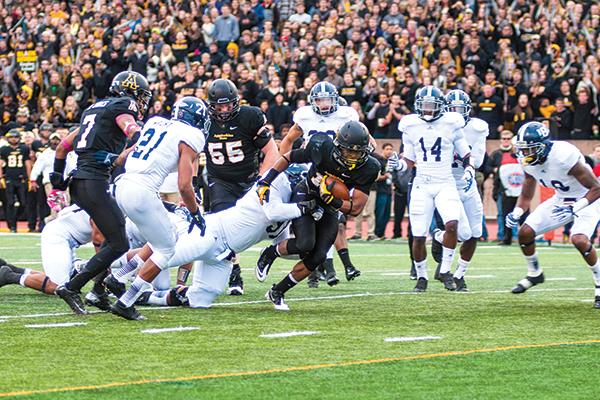 Freshman running back Marcus Cox rushes to the end zone during the Black Saturday game against Georgia Southern. The Mountaineers flew past the Eagles for a 38-14 victory at home. Photo by Aneisy Cardo  |  The Appalachian