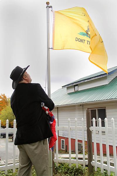 Mayoral candidate Brad Harmon puts up multiple flags beside Dixie Pride on King Street. Harmon owns Harmon's Dixie Pride Shop on King Street, where he offers historic photos, ghost walks around town and other goods.  Photos by Molly Cogburn  |  The Appalachian