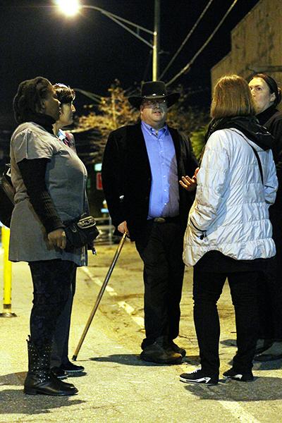 Mayoral candidate Brad Harmon, owner of Harmon's Dixie Pride, takes a group of international teachers, (from left to right) Lungelwa Phakathi of South Africa, Feruza Jurayeva of Uzbekastan, Aneta Ozga of Poland, and Rasa Paskeviciene of Lithuania, on a ghost tour of downtown Boone. Photo by Molly Cogburn  |  The Appalachian