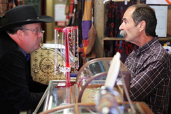 Mayoral candidate Brad Harmon converses with Bill Parish, the owner of the shop Highway Robbery, about his platform and intentions for Boone if he were to be elected as mayor.  Photo by Molly Cogburn  |  The Appalachian
