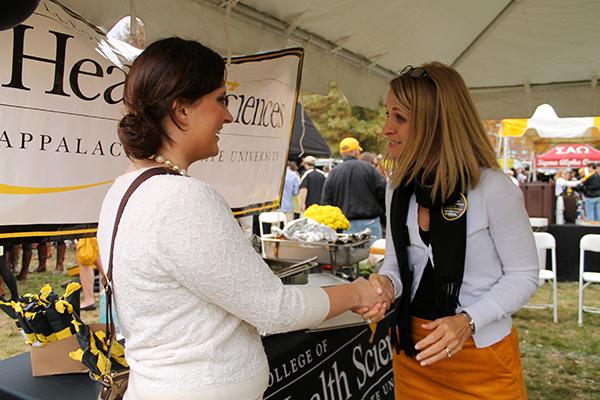 Mayoral candidate Jenny Church speaks with Tracy Hastings, public relations and communications staff for Health Sciences, during tailgating before an Appalachian State football game. Photo by Molly Cogburn  |  The Appalachian