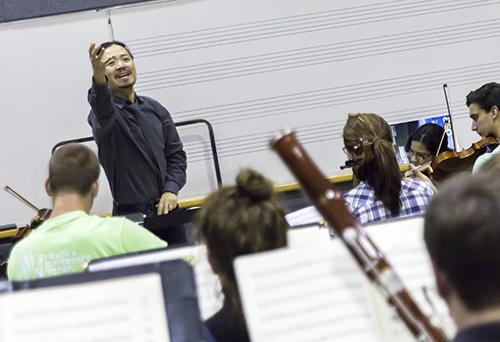 Chung Park, Director of Orchestral Activities, cues the bassoons in a run of Beethoven’s Pastoral Symphony during a rehearsal for the Symphony’s upcoming concert. The concert takes place in the Schaefer Center for the Performing Arts at 8 p.m. Friday and will feature professor Bair Shagdaron on piano. Photo by Paul Heckert  |  The Appalachian