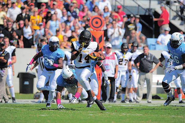 Freshman running back Marcus Cox sprints down the field during Saturday’s game against The Citadel. The Mountaineers fell to bulldogs 31-28 in overtime. Photo courtesy of Keith Cline