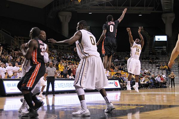 Chris Burgess hits a jumper from the top of the key in the home-opening loss to Campbell, 73-66. Burgess finished the night with 14 points off the bench. Molly Cogburn | The Appalachian