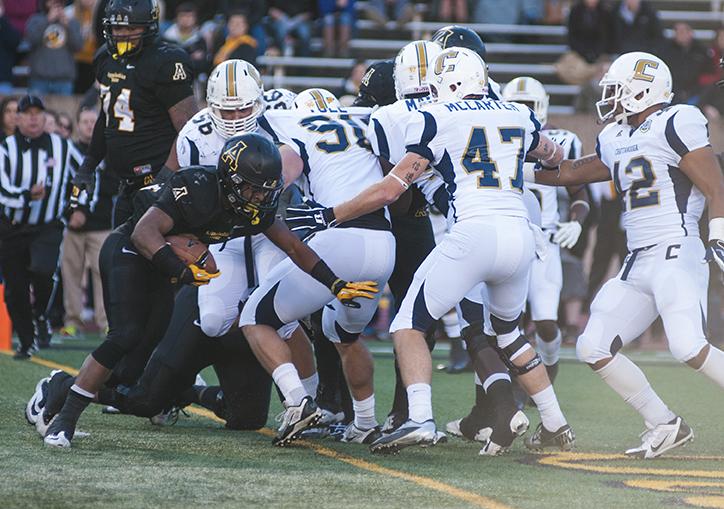 Marcus Cox completes a one-yard run to score the second touchdown of the first half of Saturday's home game against Chattanooga. Carson Hager | The Appalachian