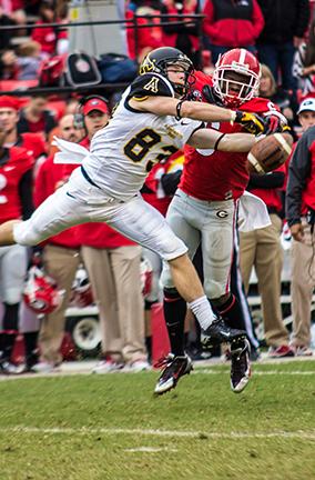 Sophomore wide receiver Simms McElfresh’s catch is disrupted by a Georgia defender during Saturday’s game. Despite a strong first quarter, the Bulldogs bit straight through the Mountaineers for a 45-6 win. Photo by Paul Heckert  |  The Appalachian