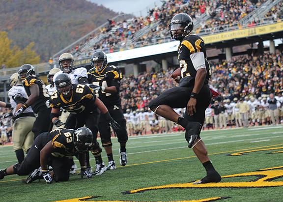 Quarterback Jamal Londry-Jackson looks at the crowd after breaking through the Terrier defensive line to run the ball in for a touchdown against Wofford in 2012. The Mountaineers lost the game, 38-28. Photo by Paul Heckert  |  The Appalachian