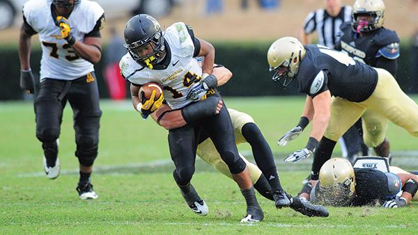 Freshman running back Marcus Cox plows through the defense during Saturday’s game against Wofford. The Mountaineers sailed past the Terriers for a 33-21 win. Photo courtesy of Keith Cline