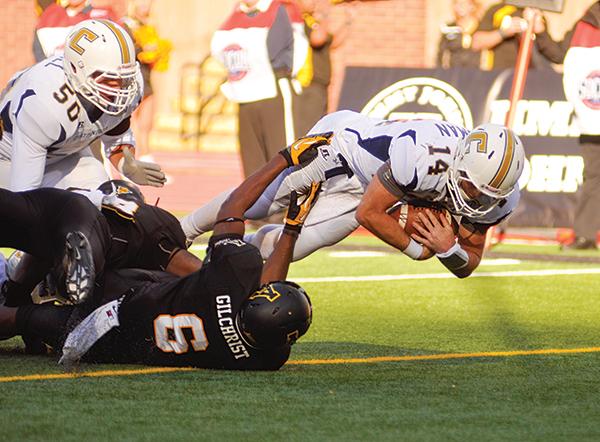 Freshman outside linebacker Kennan Gilchrist attempts to stop Chattanooga quarterback Jacob Heusman from scoring a touchdown. The Mountaineers fell to the Mocs 25-28 at home, making this the Mocs first win in Mountaineer territory since 1983. Photo by Justin Perry  |  The Appalachian