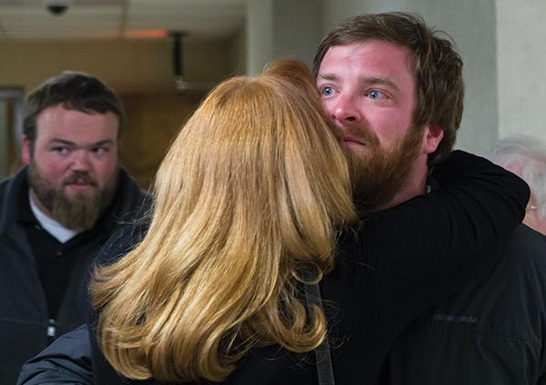 Boone mayoral elect Andy Ball (right) receives an emotional hug from his mother Amy Edelberg after his win was confirmed Tuesday night. Photo by Paul Heckert  |  The Appalachian