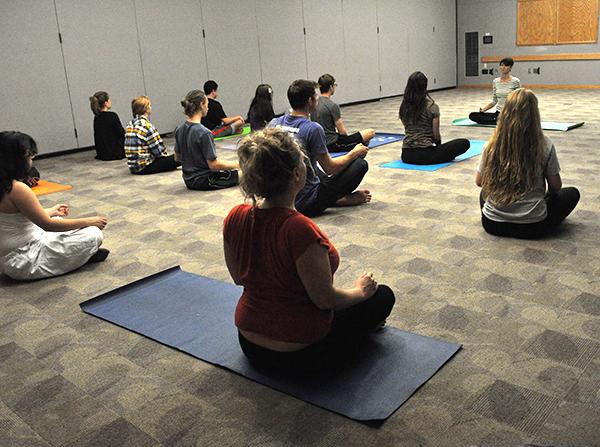 Students practiced yoga and meditation Tuesday in the Attic Window room of the student union. Yesplus yoga is held every Tuesday from 5-6 p.m. Photo by Maggy Boutwell  |  The Appalachian