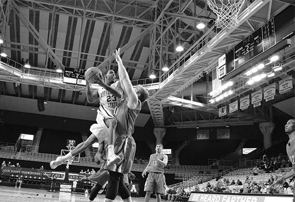 Junior guard Mike Neal powers through to the basket against North Greenville on Wednesday night. The Mountaineers defeated the Crusaders 78-70. Photo by Aneisy Cardo  |  The Appalachian