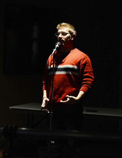 Senior English major Zachary Corsi opens up at Verses Slam Team's first poetry slam of the semester. The slam was held in Whitewater Cafe Friday night. Photo by Olivia Wilkes