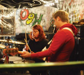 Ryan Hoots (left) and Chris French (right) of Muscle & Bone play Sunday evening at the Wood Circle House. The Wood Circle House’s first show of the season showcased five bands, including headliner Discourse. Photo by Olivia Wilkes  |  The Appalachian