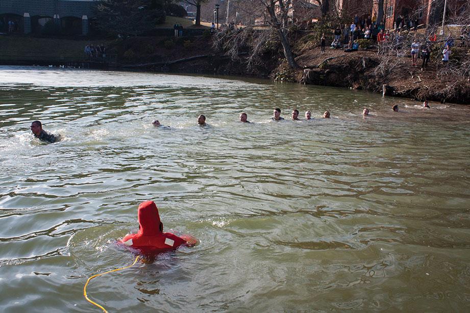 Members of the Appalachian State Army ROTC cross Duck Pond before their jump in Thursday afternoon's Polar Plunge.  