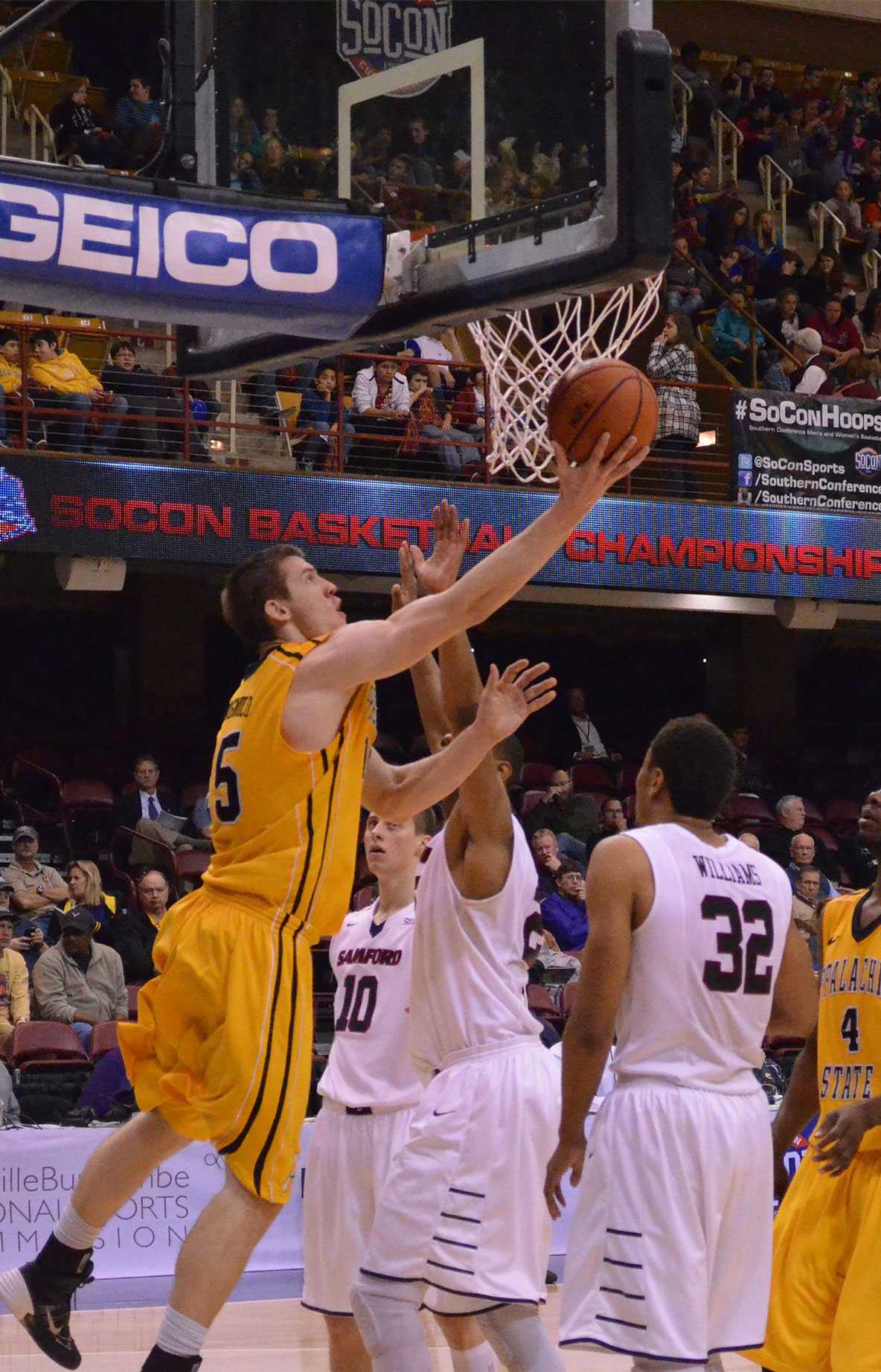 Senior forward Tommy Spagnolo lays up the ball under the basket against Samford during the first round of the SoCon basketball tournament. Samford defeated Appalachian State 70-56. Photo by Josh Farmer | The Appalachian