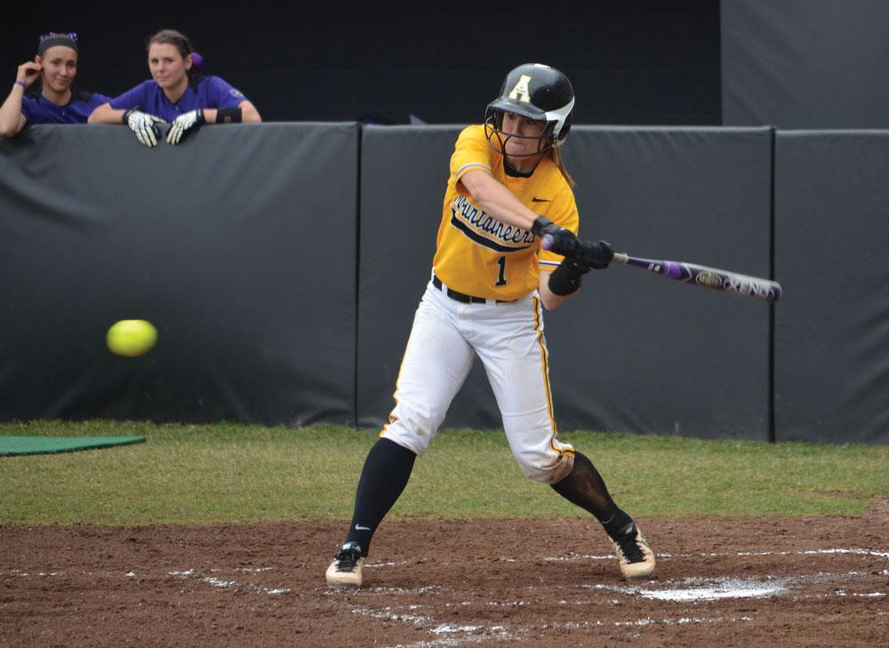 Junior catcher Sarah Warnock swings at a pitch during a home game against Western Carolina on Sunday afternoon. The Mountaineers won the series against the Catamounts 2-1.  Photo by Corey Spiers  |  The Appalachian