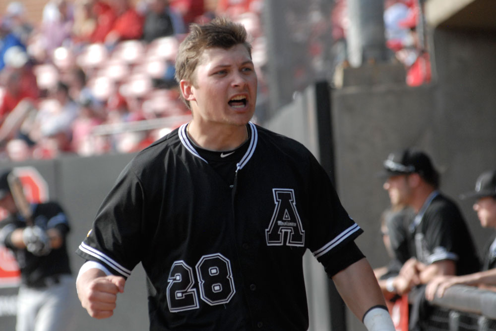Senior utility player Tyler Zupcic tries to ignite his team on his way back to the dugout during a game against N.C. State in February. Photo by Corey Spiers | The Appalachian