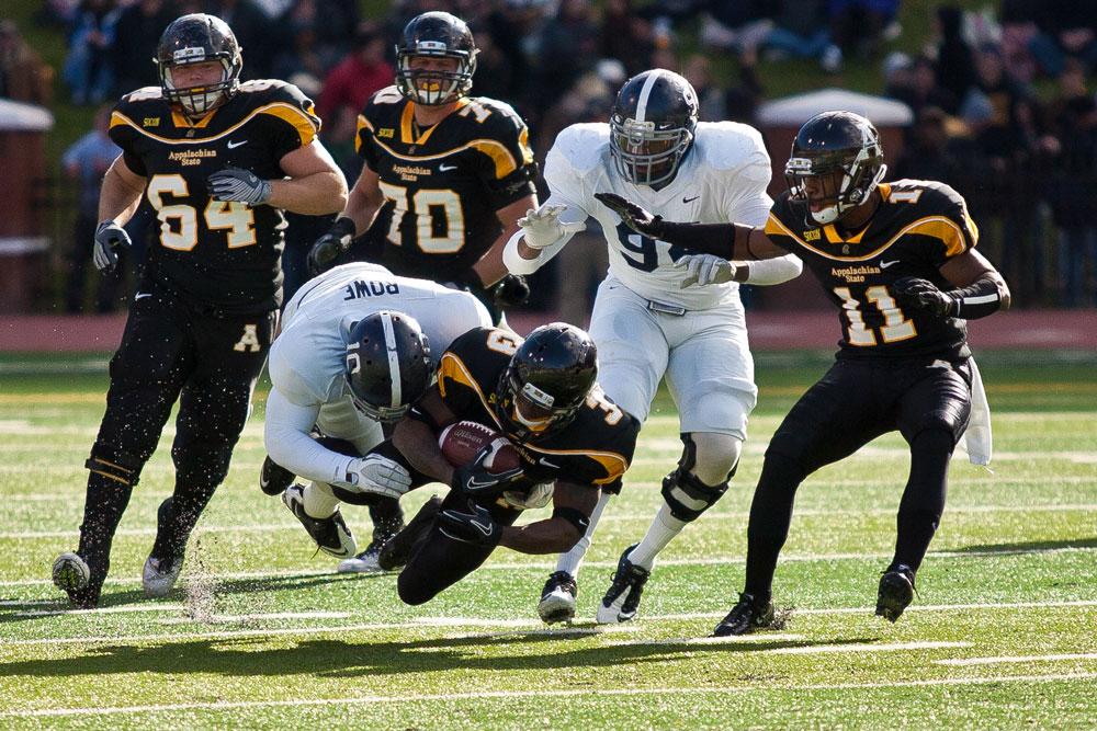 Then senior wide receiver Steve Miller is taken down by a Georgia Southern defender in the Mountaineers 2011 win against the Eagles. Appalachian State will challenge the long-time rival Sept. 25 in the upcoming 2014 season. The game will be televised on ESPNU. Photo by Adam Jennings  |  The Appalachian