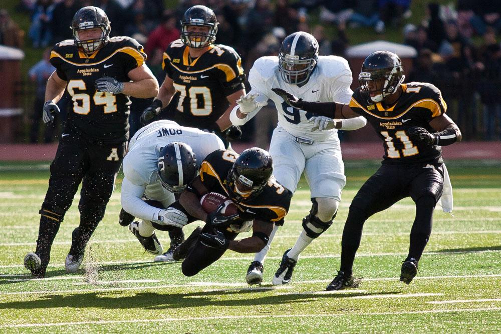 Then senior wide receiver Steve Miller is taken down by a Georgia Southern defender in the Mountaineers 2011 win against the Eagles. Appalachian State will challenge the long-time rival Sept. 25 in the upcoming 2014 season. The game will be televised on ESPNU. Photo by Adam Jennings | The Appalachian