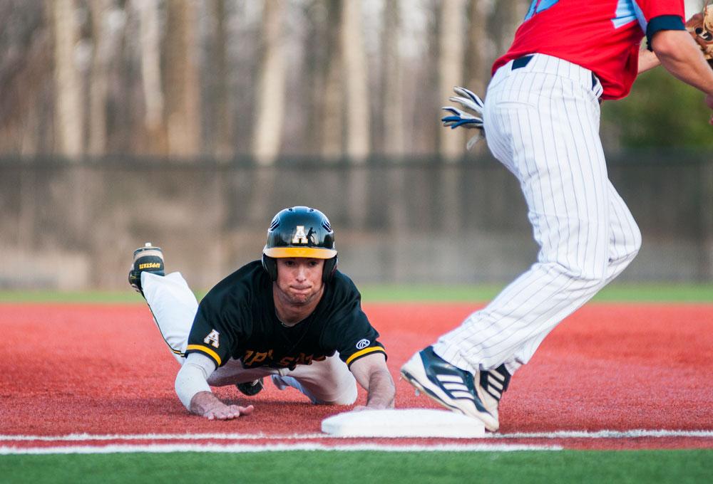 (Above) Sophomore infielder Michael Pierson slides into first base after attempting to steal second during the second inning of Friday’s game against The Citadel.   Photo by Joshua Kincaid  |  The Appalachian