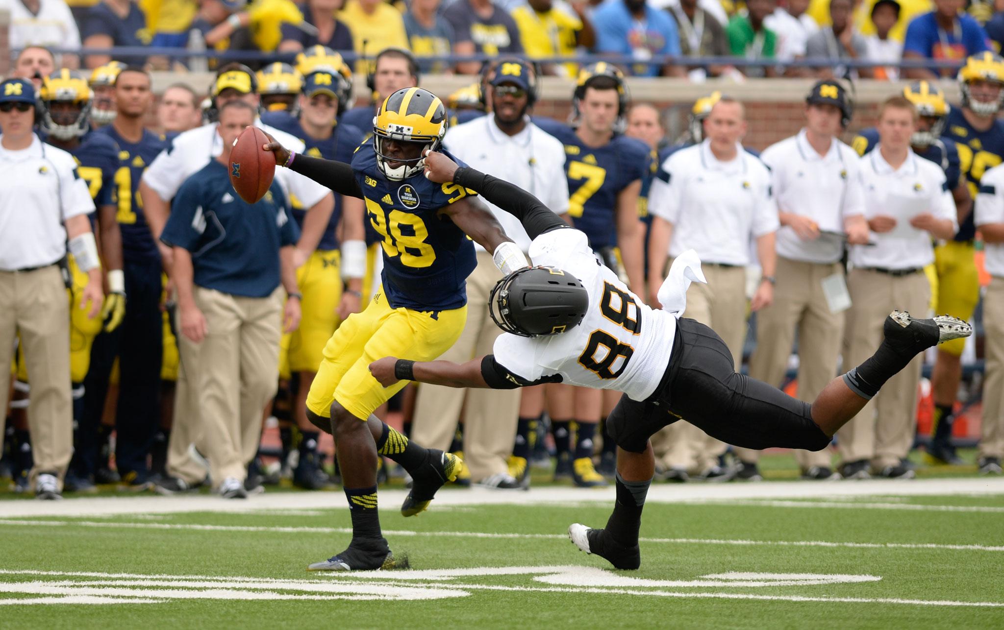 Sophomore wide receiver Jaquil Capel attempts to take down the Michigan offense during the first half of Saturday's season opening game against Michigan. The Wolverines defeated the Mountaineers 52-14. Photo by Justin Perry | The Appalachian